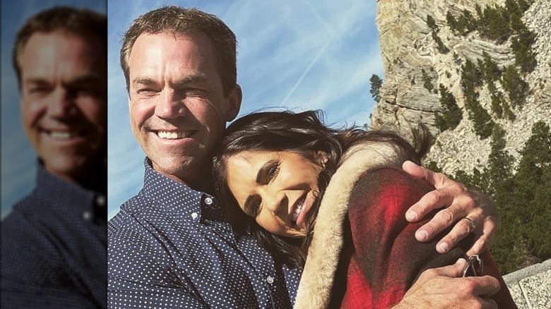 Bryon Noem smiling and looking away and Kristi Noem smiling at the camera