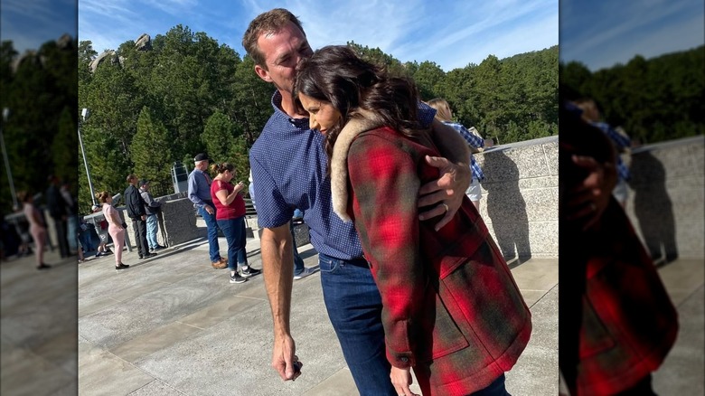 Bryon Noem kissing Kristi Noem on the head