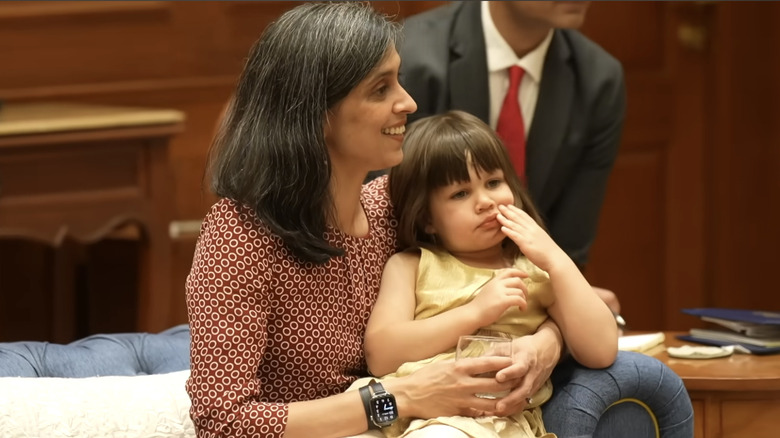 Usha Vance with her daughter Mirabel on her lap.