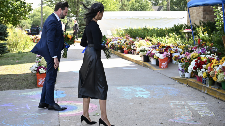 JD and Usha in front of a Christian school
