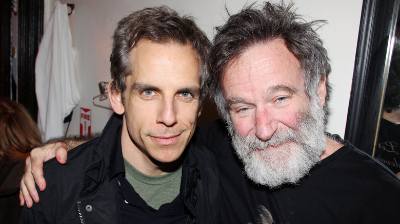 Ben Stiller and Robin Williams embracing backstage at a Broadway play in 2011