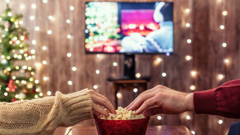 Couple watching movie with popcorn 