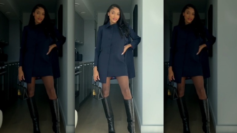 woman wearing nay dress with black accessories