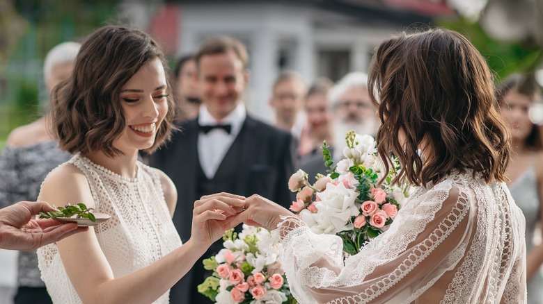 Women exchanging rings