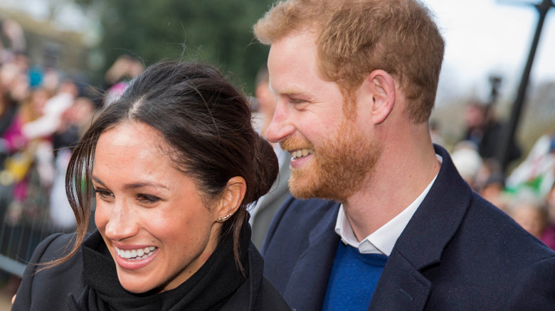 Meghan and Harry smiling