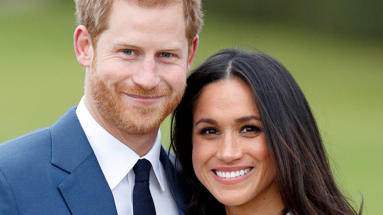 Prince Harry and Meghan Markle smile for a photo