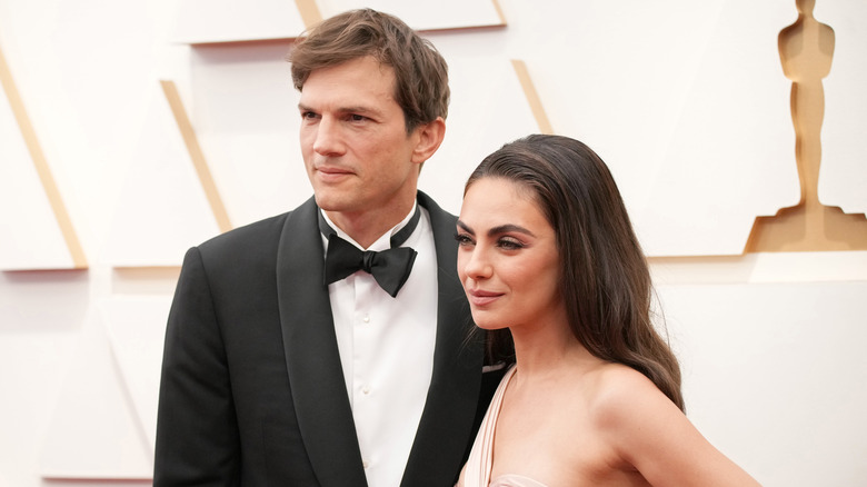 Ashton Kutcher and Mila Kunis on a red carpet