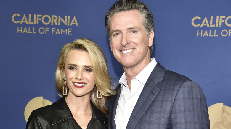 Jennifer Siebel and Gavin Newsom smiling next to each other