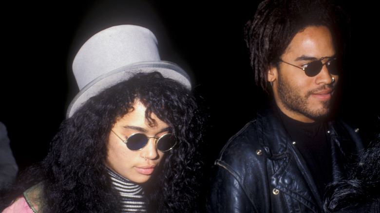 Lisa Bonet and Lenny Kravitz wearing sunglasses at an event