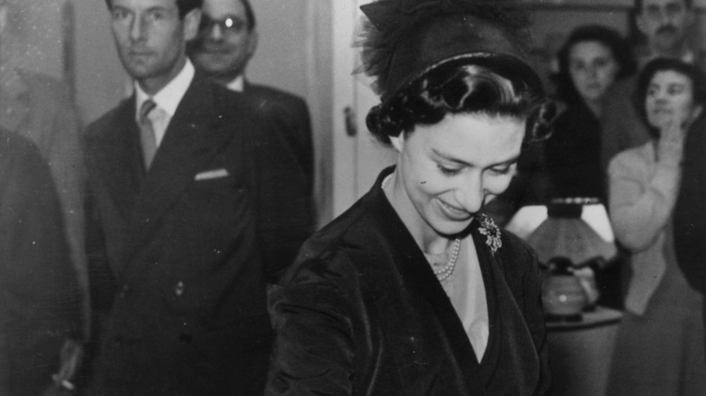 Captain Peter Townsend looking at Princess Margaret from afar