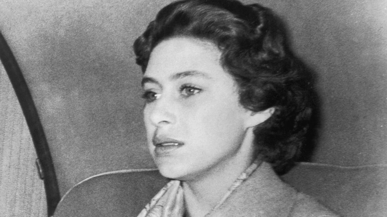 Princess Margaret looking deep in thought in the back of a car