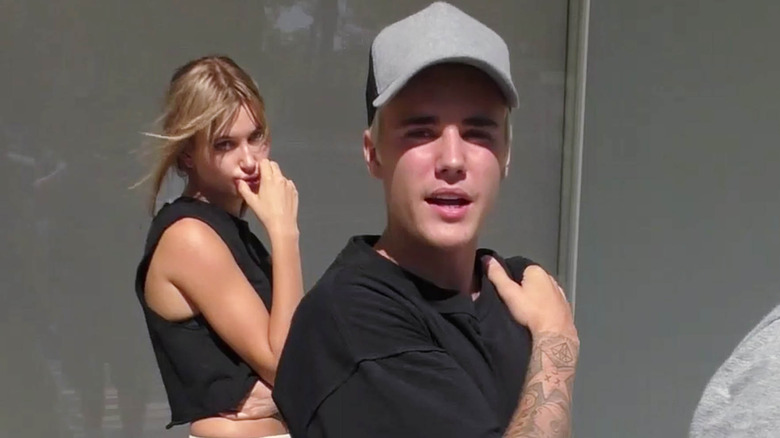 Hailey Bieber standing behind Justin Bieber in 2015