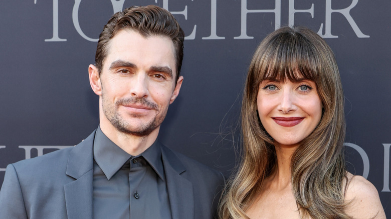 Dave Franco and Alison Brie smiling at the Together premiere