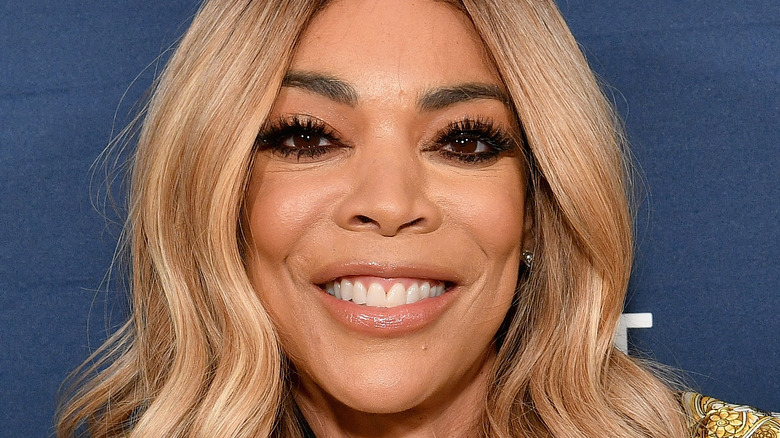 Wendy Williams smiling with blonde hair