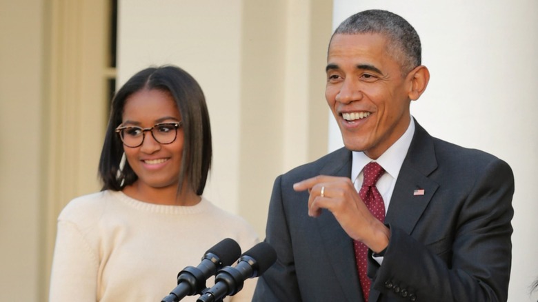 Sasha Obama Barack Obama smiling