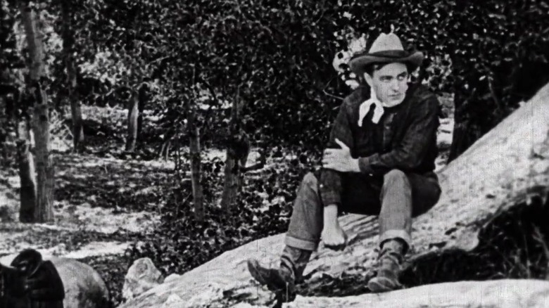 Harry Carey Sr. showing off his arm move in the 1917 film Straight Shooting