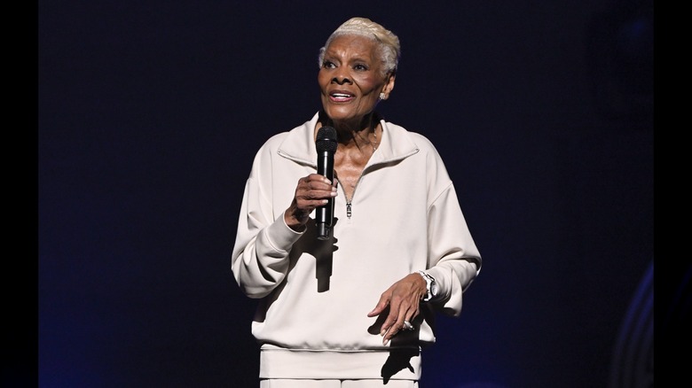 Dionne Warwick holding a mic