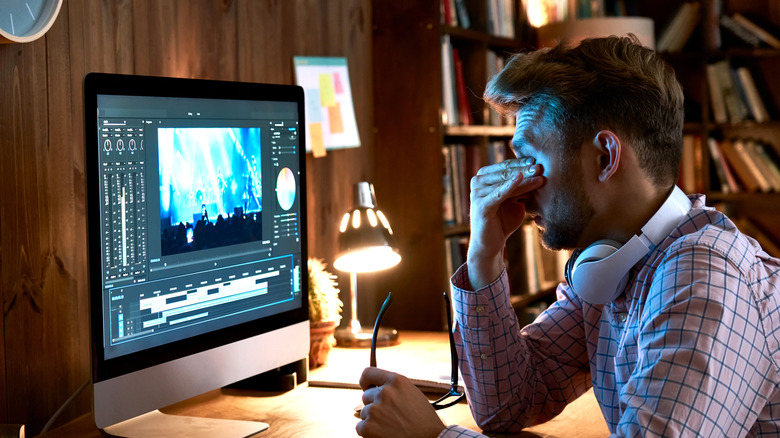 man fatigued at desk