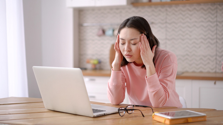woman fatigued at desk