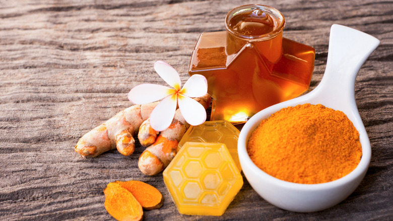 Turmeric and honey on a table