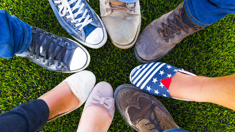 feet form a circle on grass