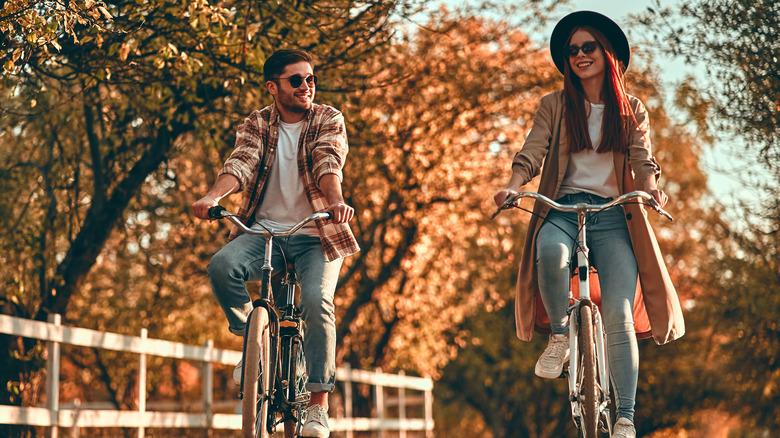 young couple riding bikes