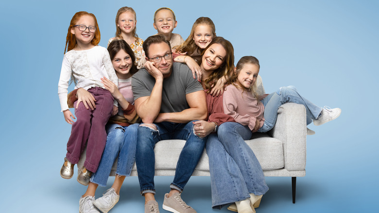 Busby family on a white couch