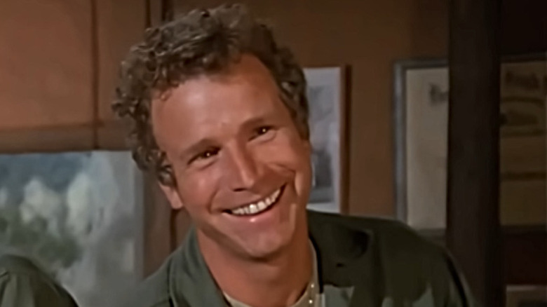 Wayne Rogers as Trapper on MASH