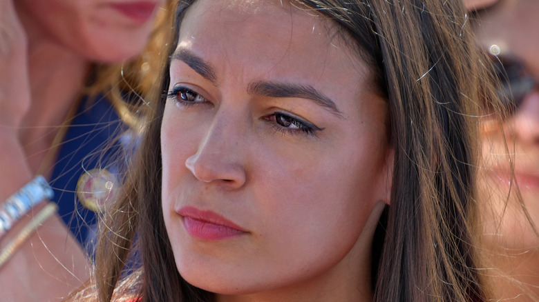 Alexandria Ocasio-Cortez serious looking
