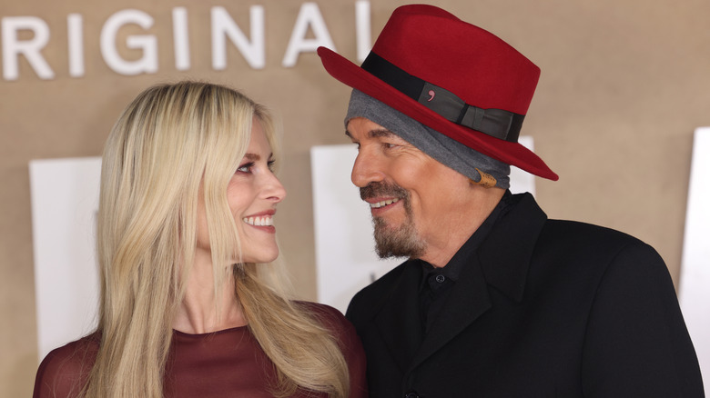Ali Larter and Billy Bob Thornton looking at each other and smiling at a Landman event