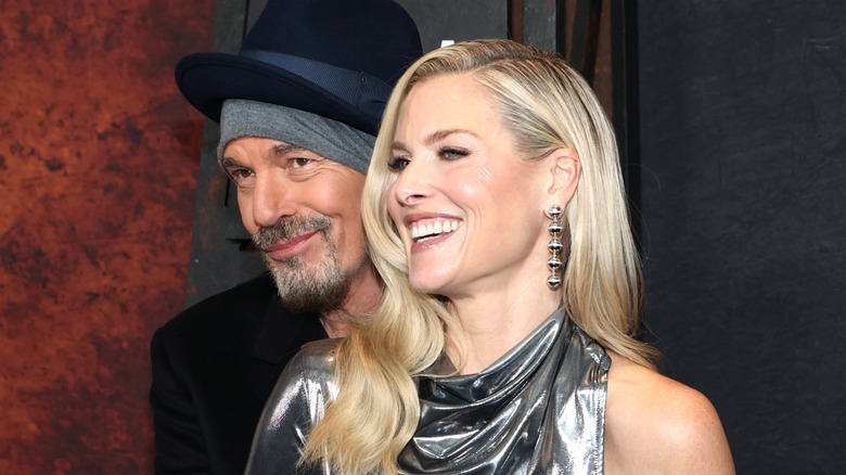 Billy Bob Thornton and Ali Larter smiling at an event