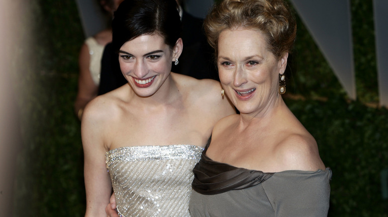 Anne Hathaway and Meryl Streep hugging at the 2009 Vanity Fair Oscars Party