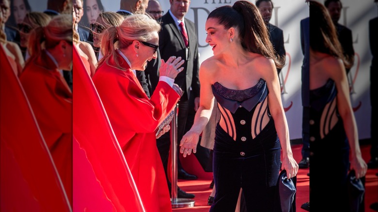 Anne Hathaway and Meryl Streep joking at the "Devil Wears Prada 2" premiere