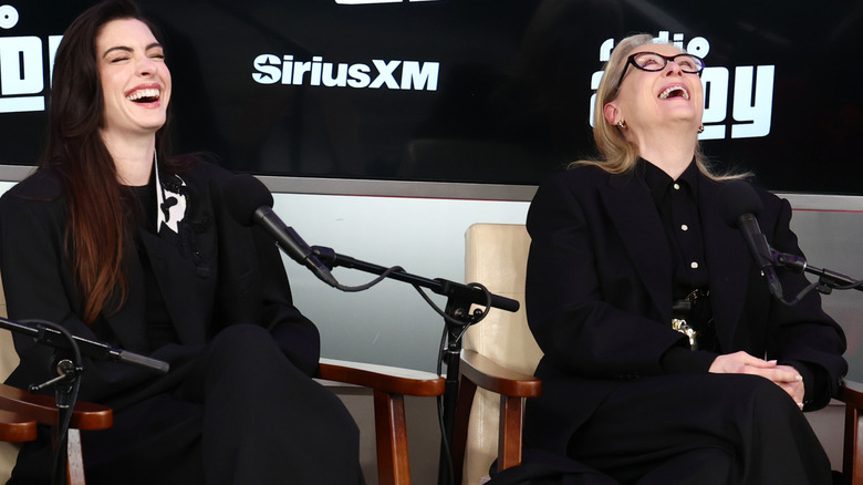Anne Hathaway and Meryl Streep laughing at a Sirius XM interview