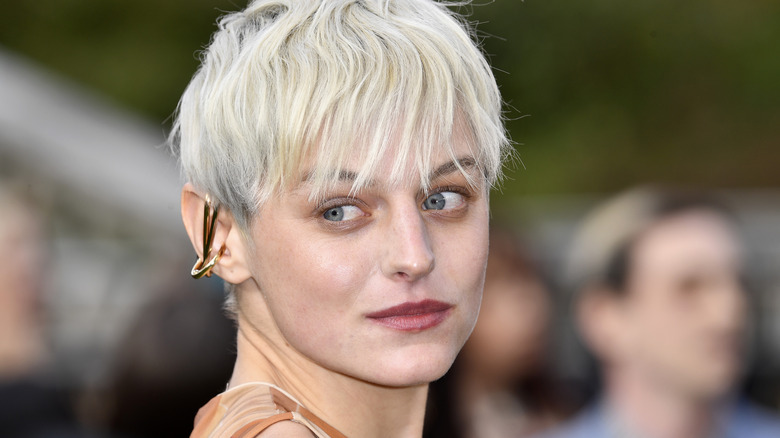 Emma Corrin with short hair