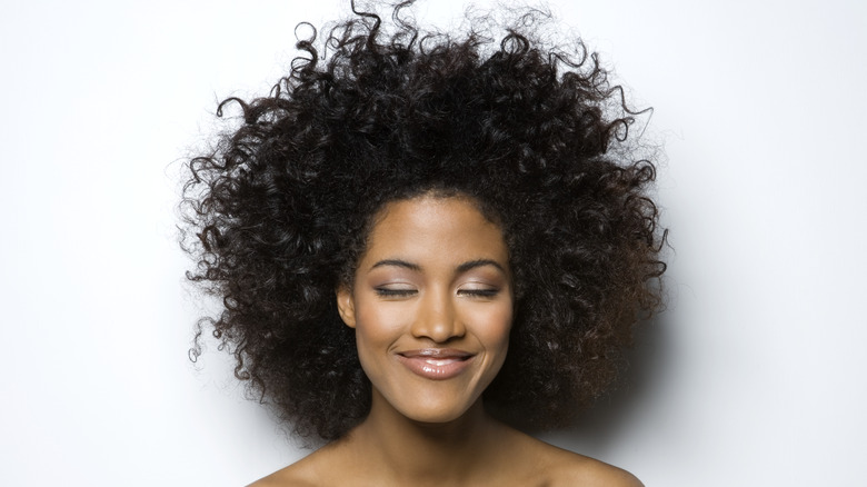 Woman with natural coiled hair