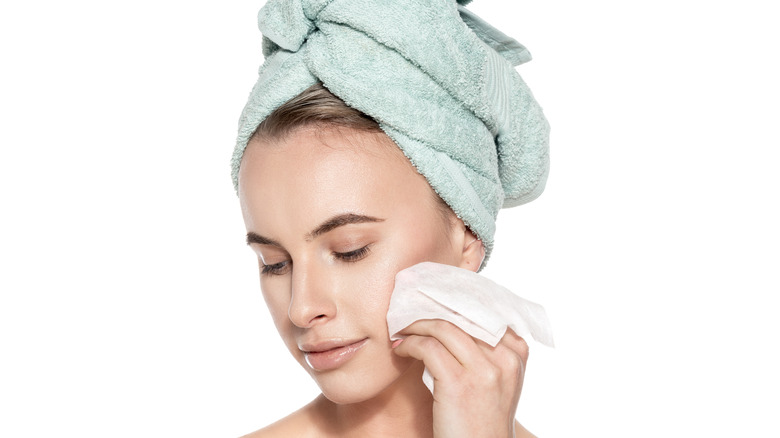 woman removing eye makeup