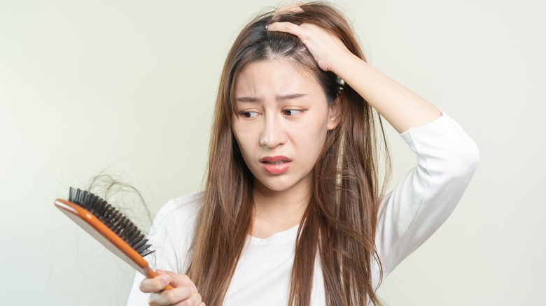 woman losing hair 