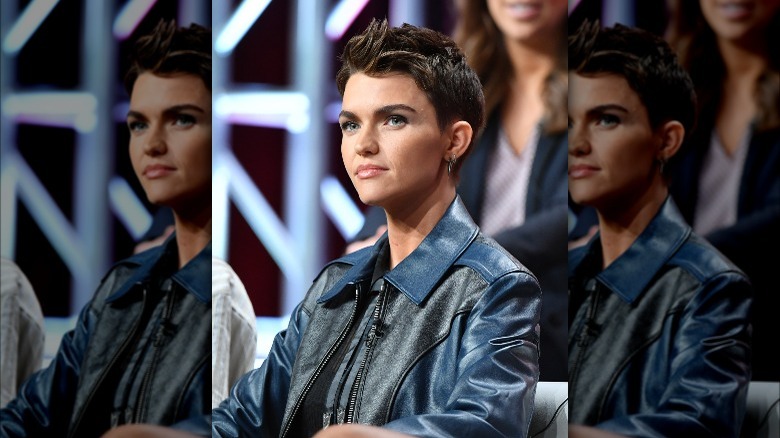Ruby Rose sitting during a press tour
