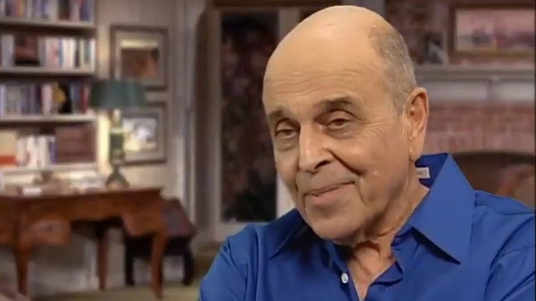 Actor Gino Conforti wearing a blue shirt while remembering Lucille Ball