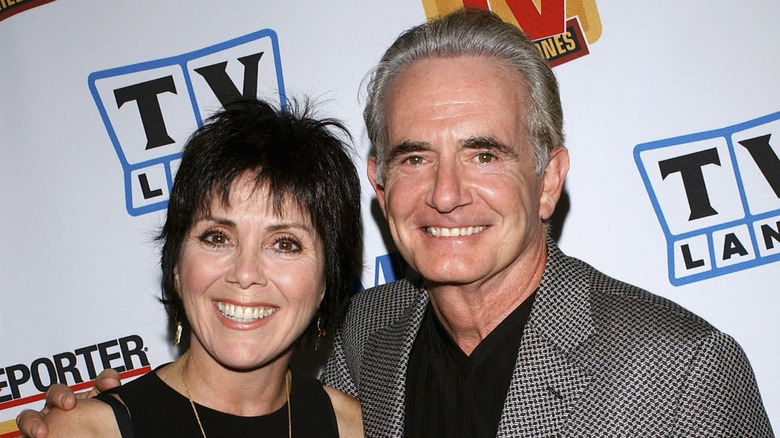 Joyce DeWitt and Richard Kline smiling at a 2004 cocktail party
