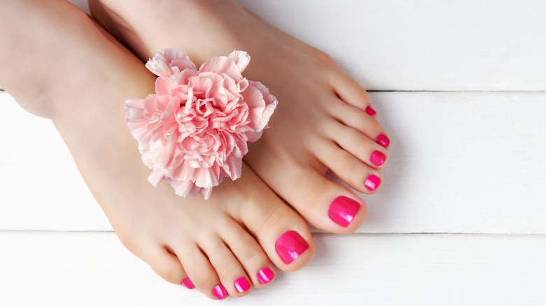 Toes with pink nail polish