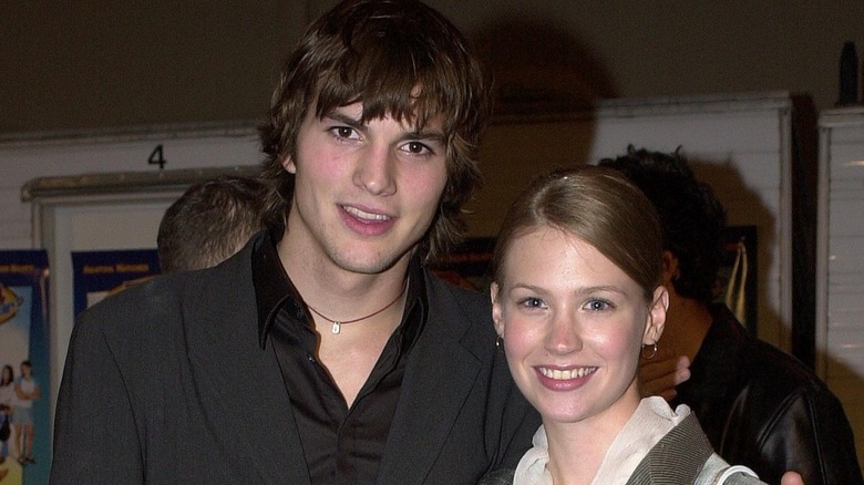 Closeup of Ashton Kutcher and January Jones smiling in 2000s