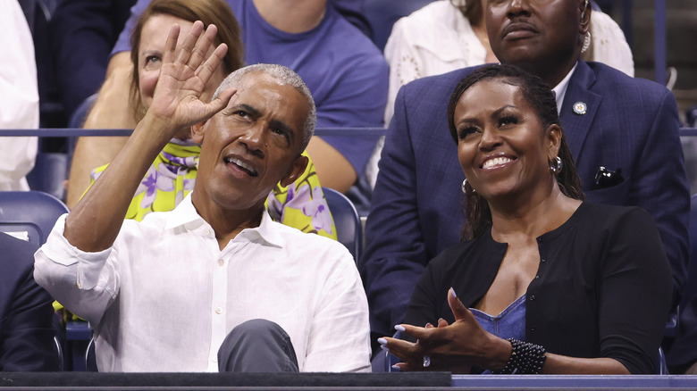 Barack Obama and Michelle Obama watching a tennis match