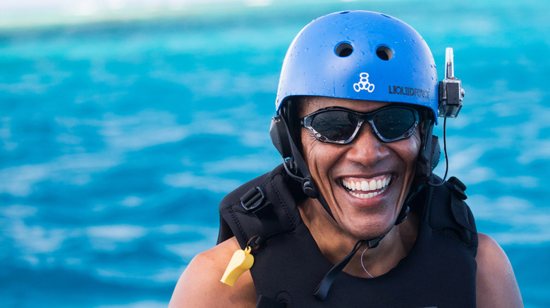 Barack Obama wearing a helmet