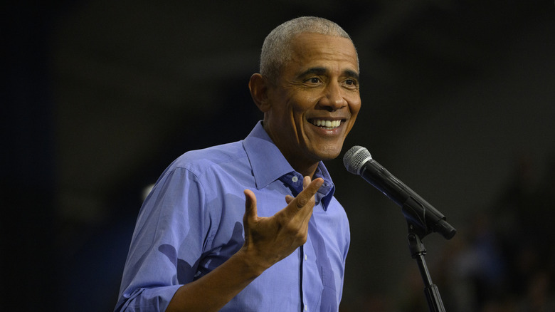 Barack Obama speaking into a microphone