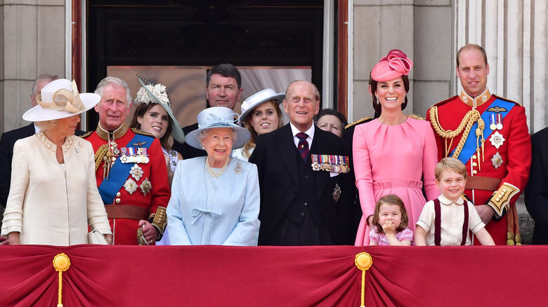 The British royal family stand on the balcony of Buckingham Palace