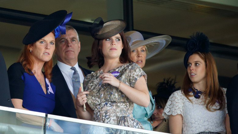 Princess Beatrice and Princess Eugenie with their parents on a balcony