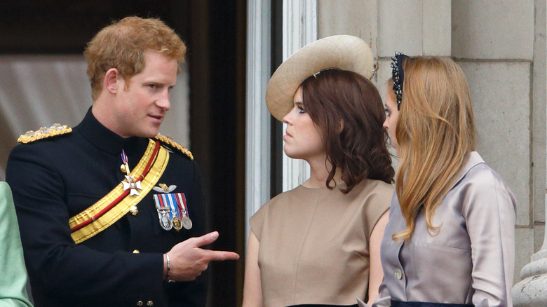 Prince Harry, Princess Eugenie, and Princess Beatrice stand on the Buckingham Palace balcony