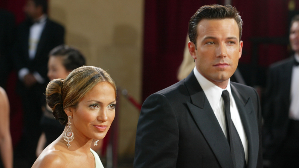 Ben Affleck standing with Jennifer Lopez
